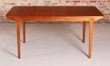 Load image into Gallery viewer, Mid Century extending teak dining table by McIntosh, circa 1960s. 