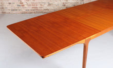Load image into Gallery viewer, Mid Century extending teak dining table by McIntosh, circa 1960s. 