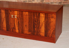Load image into Gallery viewer, A pair of Mid Century rosewood low sideboards with hinged brass handles by Troeds, Sweden, circa 1970s