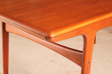 Load image into Gallery viewer, Danish Mid Century extending teak dining table by Arne Hovmand Olsen for Mogens Kold, circa 1960s