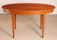 Load image into Gallery viewer, Mid Century extending teak dining table by Greaves&Thomas, circa 1960s.