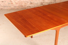 Load image into Gallery viewer, Mid Century extending teak dining table by Mcintosh, circa 1960s.