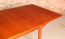 Load image into Gallery viewer, Mid Century extending teak dining table by Mcintosh, circa 1960s.