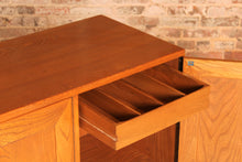 Load image into Gallery viewer, A mid century Ercol Windsor elm sideboard on casters, circa 1960s