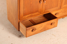 Load image into Gallery viewer, A mid century Ercol Windsor elm sideboard on casters, circa 1960s