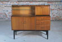 Load image into Gallery viewer, British Mid Century Nathan drinks cabinet in tola and black, circa 1950s.