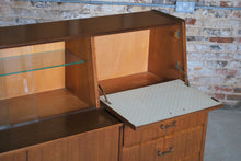 Load image into Gallery viewer, British Mid Century Nathan drinks cabinet in tola and black, circa 1950s.