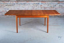 Load image into Gallery viewer, Danish Mid Century solid teak exteding dining table by Glostrup Mobelfabrik, circa 1970s.