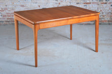 Load image into Gallery viewer, Danish Mid Century solid teak exteding dining table by Glostrup Mobelfabrik, circa 1970s.