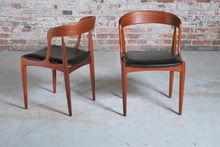 Load image into Gallery viewer, Set of 4 Danish Mid Century Model 16 teak dining chairs with original black vinyl upholstery by Johannes Andersen for Uldum Mobelfabrik, circa 1960s.
