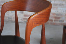 Load image into Gallery viewer, Set of 4 Danish Mid Century Model 16 teak dining chairs with original black vinyl upholstery by Johannes Andersen for Uldum Mobelfabrik, circa 1960s.