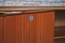 Load image into Gallery viewer, A Mid Century Dunvegan teak sideboard designed by Tom Robertson and manufactured by A.H. McIntosh of Kirkcaldy, Scotland, circa 1960s.