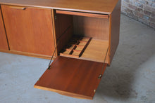 Load image into Gallery viewer, A Mid Century Dunvegan teak sideboard designed by Tom Robertson and manufactured by A.H. McIntosh of Kirkcaldy, Scotland, circa 1960s.