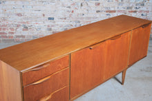 Load image into Gallery viewer, A Mid Century Dunvegan teak sideboard designed by Tom Robertson and manufactured by A.H. McIntosh of Kirkcaldy, Scotland, circa 1960s.