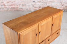 Load image into Gallery viewer, Mid Century Ercol Windsor elm sideboard on casters, c. 1960s