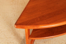 Load image into Gallery viewer, Danish Mid Century solid teak corner / coffee table with a magazine shelf by S. Burchardt-Nielsen, circa 1970s
