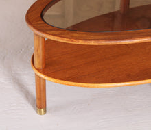 Load image into Gallery viewer, Mid Century oval 2-tier teak coffee table with a smoked glass top and brass feet by G-plan, circa 1970s
