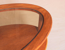 Load image into Gallery viewer, Mid Century oval 2-tier teak coffee table with a smoked glass top and brass feet by G-plan, circa 1970s
