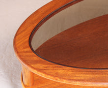 Load image into Gallery viewer, Mid Century oval 2-tier teak coffee table with a smoked glass top and brass feet by G-plan, circa 1970s
