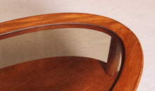 Load image into Gallery viewer, Mid Century oval 2-tier teak coffee table with a smoked glass top and brass feet by G-plan, circa 1970s
