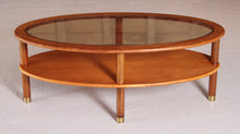 Load image into Gallery viewer, Mid Century oval 2-tier teak coffee table with a smoked glass top and brass feet by G-plan, circa 1970s
