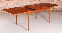 Load image into Gallery viewer, Mid Century extending teak dining table by McIntosh, circa 1960s.&nbsp;
