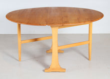 Load image into Gallery viewer, Mid Century Ercol model 610 gate leg dining table, circa 1970s

