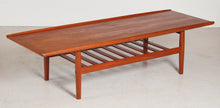 Load image into Gallery viewer, Danish Mid Century large teak coffee table with a magazine rack by Grete Jalk, circa 1960s
