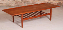 Load image into Gallery viewer, Danish Mid Century large teak coffee table with a magazine rack by Grete Jalk, circa 1960s
