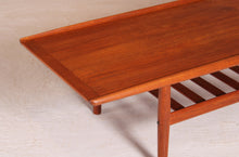 Load image into Gallery viewer, Danish Mid Century large teak coffee table with a magazine rack by Grete Jalk, circa 1960s

