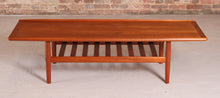 Load image into Gallery viewer, Danish Mid Century large teak coffee table with a magazine rack by Grete Jalk, circa 1960s
