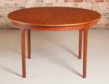 Load image into Gallery viewer, Mid Century round extending teak dining table by McIntosh, circa 1960s
