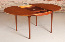 Load image into Gallery viewer, Mid Century round extending teak dining table by McIntosh, circa 1960s

