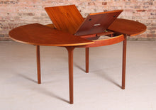 Load image into Gallery viewer, Mid Century round extending teak dining table by McIntosh, circa 1960s

