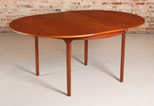 Load image into Gallery viewer, Mid Century round extending teak dining table by McIntosh, circa 1960s
