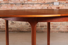 Load image into Gallery viewer, Mid Century round extending teak dining table by McIntosh, circa 1960s
