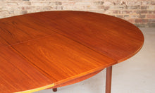 Load image into Gallery viewer, Mid Century round extending teak dining table by McIntosh, circa 1960s
