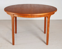 Load image into Gallery viewer, Mid Century round extending teak dining table by McIntosh, circa 1970s
