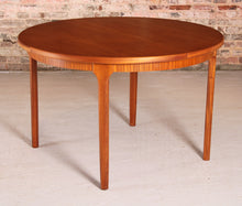 Load image into Gallery viewer, Mid Century round extending teak dining table by McIntosh, circa 1970s
