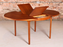 Load image into Gallery viewer, Mid Century round extending teak dining table by McIntosh, circa 1970s
