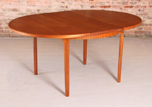 Load image into Gallery viewer, Mid Century round extending teak dining table by McIntosh, circa 1970s
