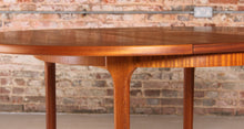 Load image into Gallery viewer, Mid Century round extending teak dining table by McIntosh, circa 1970s
