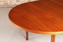 Load image into Gallery viewer, Mid Century round extending teak dining table by McIntosh, circa 1970s
