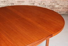 Load image into Gallery viewer, Mid Century round extending teak dining table by McIntosh, circa 1970s
