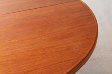 Load image into Gallery viewer, Mid Century round extending teak dining table by McIntosh, circa 1970s
