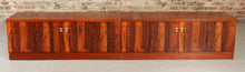 Load image into Gallery viewer, A pair of Mid Century rosewood low sideboards with hinged brass handles by Troeds, Sweden, circa 1970s
