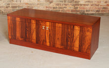 Load image into Gallery viewer, A pair of Mid Century rosewood low sideboards with hinged brass handles by Troeds, Sweden, circa 1970s
