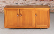 Load image into Gallery viewer, Mid Century Ercol Windsor Media Cabinet / Sideboard on Casters, circa 1970s.
