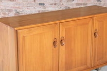 Load image into Gallery viewer, Mid Century Ercol Windsor Media Cabinet / Sideboard on Casters, circa 1970s.
