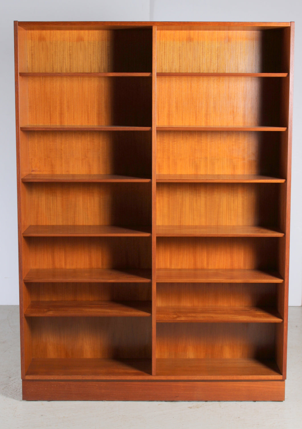 Danish Mid Century Teak Double Bookcase Designed by Carlo Jensen for Poul Hundevad, c 1970s.